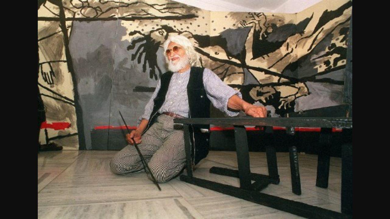 MF Husain seated in front of his 40-foot canvas ‘Violence’ at the two-artist-show 'Darkness at Noon' at Gallery 7 in Colaba in 1999. Photo: AFP